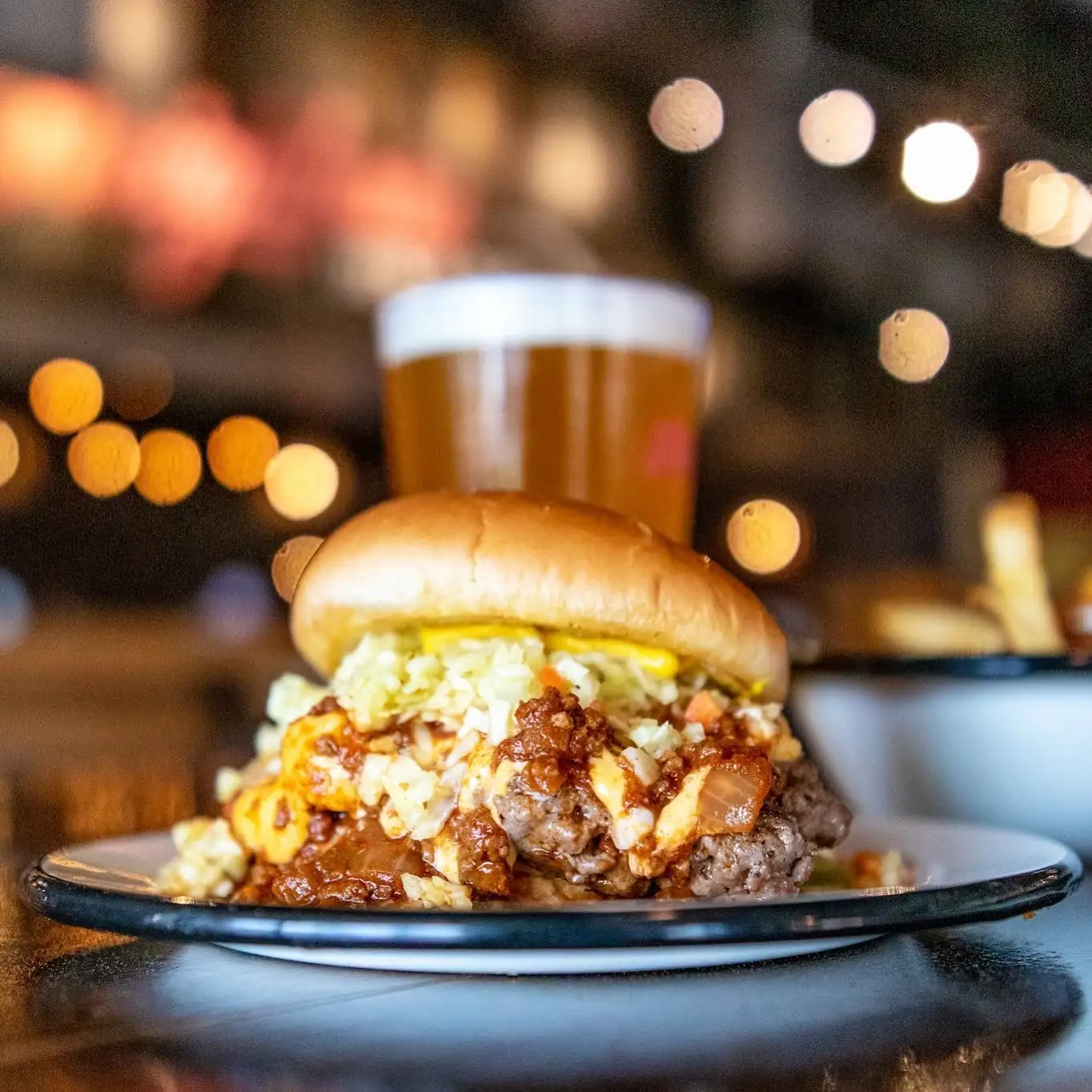 SAW’s BBQ Carolina Burger topped with pulled pork and slaw in Leeds, AL