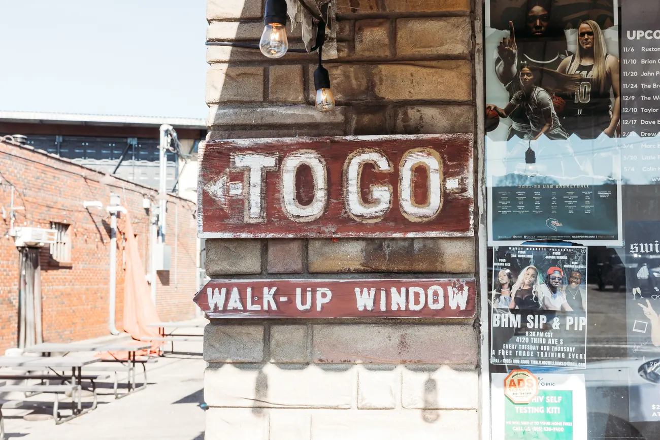 SAW's BBQ to-go walk up window sign